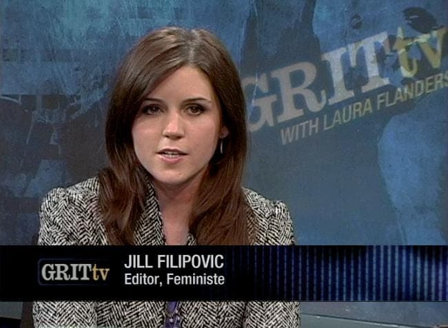 Dark-haired woman in a tweed jacket on a GRITtv news set, captioned Jill Filipovic, Editor, Feministe