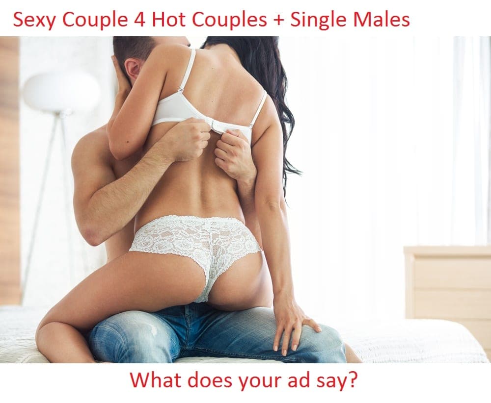 Couple embracing on a bed with red overlay text reading Sexy Couple 4 Hot Couples plus Single Males, What does your ad say